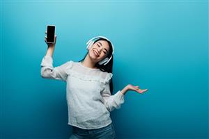 Girl listening to music on headphones